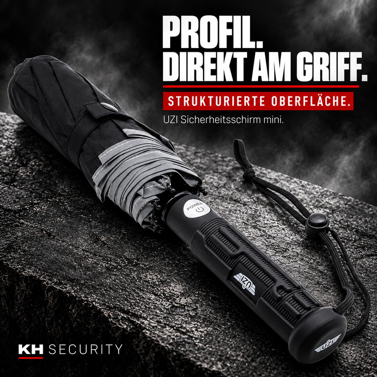 Strukturierter schwarzer Griff mit UZI Logo am Sicherheitsschirm mini